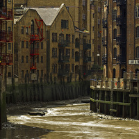 Buy canvas prints of  Low tide at Java Wharf. by Peter Jones