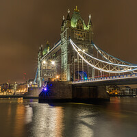 Buy canvas prints of Tower Bridge at night. by Peter Jones