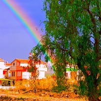 Buy canvas prints of A digital painting of a rainbow over villas in the by ken biggs