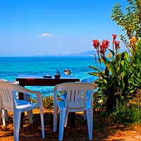 Buy canvas prints of Digital painting of a cafe table by the sea by ken biggs