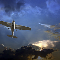 Buy canvas prints of Small fixed wing plane against a stormy sky  by ken biggs