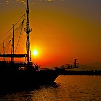 Buy canvas prints of a ship in silhouette at sunset by ken biggs