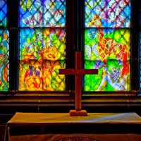 Buy canvas prints of stained glass windows in church with a cross by ken biggs