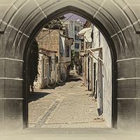 Buy canvas prints of village street through arched doors  by ken biggs