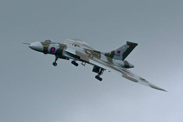 Avro Vulcan XH558 in moody skies Picture Board by Andrew Scott