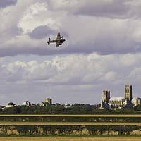 Buy canvas prints of Lancaster Bomber PA474 over Lincoln by Andrew Scott