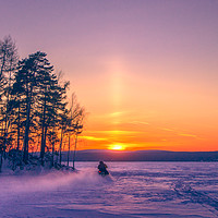 Buy canvas prints of The snow mobile race toward the Sun pillar by Svetlana Korneliuk