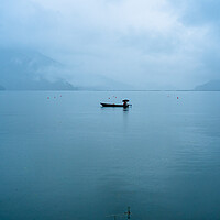 Buy canvas prints of boatman fishing on phewa lake by Ambir Tolang
