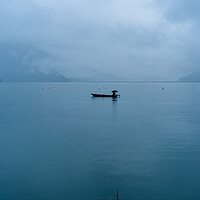 Buy canvas prints of boatman fishing on phewa lake by Ambir Tolang