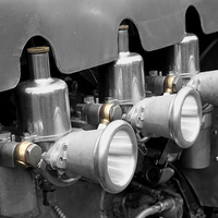 Buy canvas prints of Split toned photograph of triple S.U Carburettors  by Adrian Beese