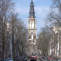 Buy canvas prints of Ornate Church Clocktower at the end of a canal in Amsterdam by Adrian Beese