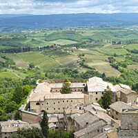 Buy canvas prints of A view of Tuscany from a medieval tower in San Gimignano by Adrian Beese
