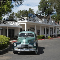 Buy canvas prints of Classic Chevrolet outside vintage motel by Adrian Beese