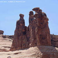 Buy canvas prints of The Sisters Arches National Park by Adrian Beese