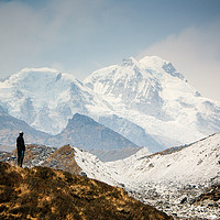 Buy canvas prints of A man contemplates the size of Kanchenjunga by Brent Olson