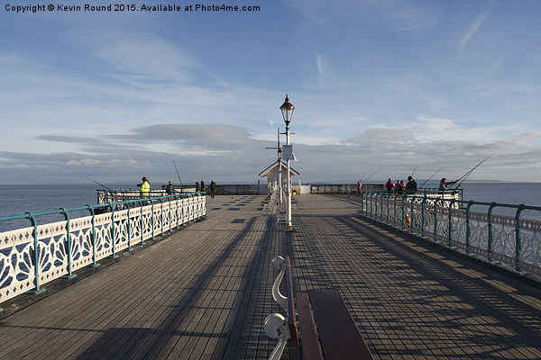 People fishing on Penarth Pier, Wales, UK Picture Board by Kevin Round