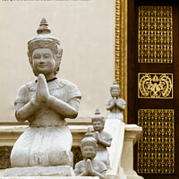 Buy canvas prints of Praying Buddhas Royal Palace, Cambodia by Jo Sowden