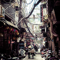 Buy canvas prints of Hanoi Side street, Vietnam by Jo Sowden