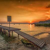 Buy canvas prints of A Breathtaking Lake Garda Sunset by Brian Fagan