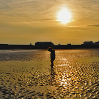 Buy canvas prints of  sunset silhouette boy by Owen Bromfield
