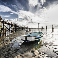 Buy canvas prints of Boats at low tide by Adrian Brockwell