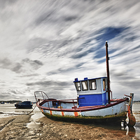 Buy canvas prints of Fishing Boat at low tide by Adrian Brockwell