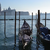 Buy canvas prints of  Gondolas overlooking San Giorgio Maggiore in Veni by Angela Starling