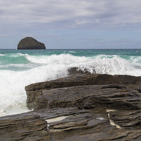 Buy canvas prints of Waves crashing over rocks with Gull rock in the di by Mark Roper