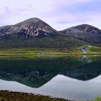 Buy canvas prints of  Reflections in Loch Slapin at Torrin Isle of Skye by John Vaughan