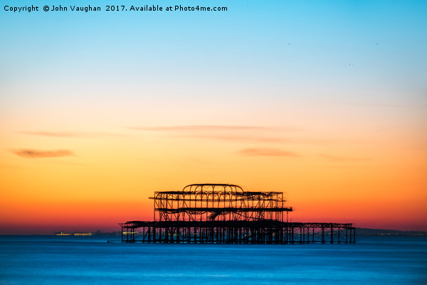 Sunset over West Pier Picture Board by John Vaughan