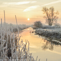 Buy canvas prints of Frosty river sunrise by Emma Varley