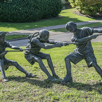 Buy canvas prints of  Tug of War Bronze Sculpture by mark sykes