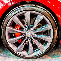 Buy canvas prints of Close up photo of a Tesla electric car alloy wheel by Naylor's Photography