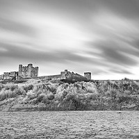 Buy canvas prints of Bamburgh Castle Beauty - Black and White by Naylor's Photography