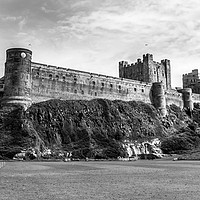 Buy canvas prints of Majestic and Mighty Bamburgh Castle in Mono by Naylor's Photography
