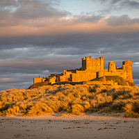 Buy canvas prints of Bamburgh Castle from the beach at Easter by Naylor's Photography