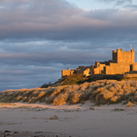Buy canvas prints of Bamburgh Castle Panorama by Naylor's Photography
