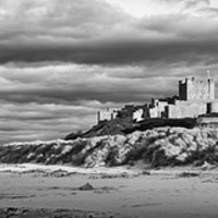 Buy canvas prints of Bamburgh Castle Panorama Mono by Naylor's Photography
