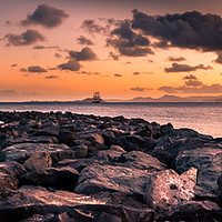 Buy canvas prints of Playa Blanca Sunset over the Rocks by Naylor's Photography
