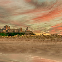 Buy canvas prints of Bamburgh Castle fiery Sunset by Naylor's Photography