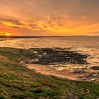 Buy canvas prints of Dreamy sunset at Bamburgh beach  by Naylor's Photography