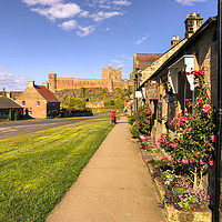 Buy canvas prints of Bamburgh cottages and imposing castle by Naylor's Photography