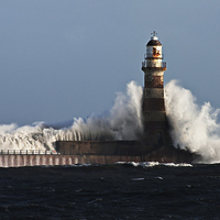 Buy canvas prints of  Roker Pier Lighthouse on a Stormy Day by Ian Aiken