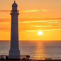 Buy canvas prints of Sunrise at Seaburn Beach with White Lighthouse by Ian Aiken