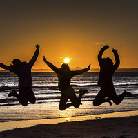 Buy canvas prints of  Jumping for joy ,on Druidstone beach. by Philip Jones