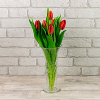 Buy canvas prints of Red Tulips in a glass vase by Richard Long