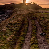 Buy canvas prints of Dunstanburgh Castle at sunrise by Phil Reay
