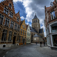 Buy canvas prints of  St James, Bruges by David Schofield