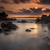 Buy canvas prints of  Sunset on the rocks by David Schofield