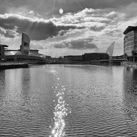 Buy canvas prints of  Sun Flare over The Quays by Stuart Giblin
